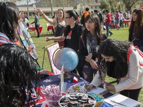 College students attend an international education fair in the quad