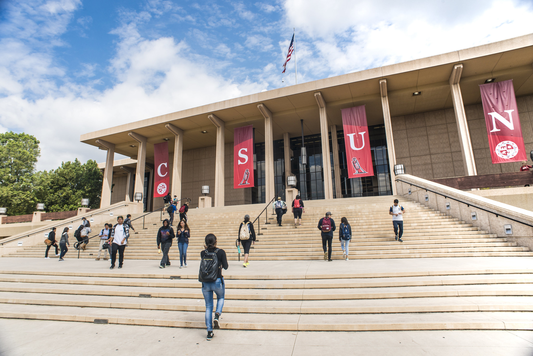 Students walk up the steps of the CSUN library.