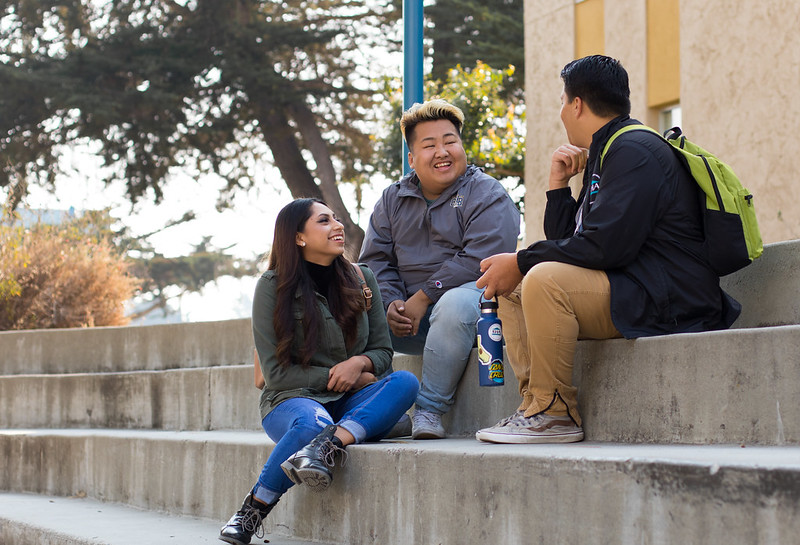 CSU Monterey Bay colllege students sitting and talking outside of class
