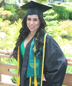 Sofia Rosales smiling in her Cal Poly Pomona cap and gown.