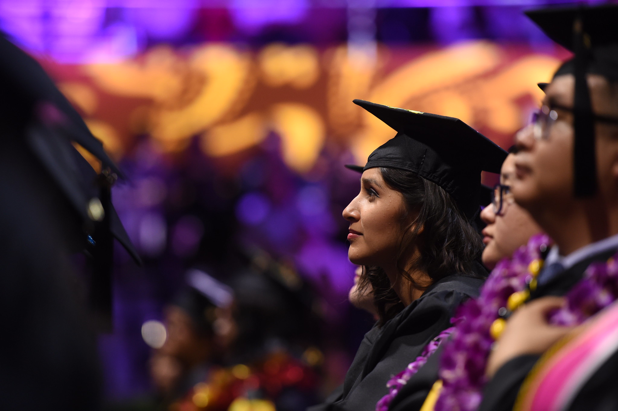 college graduate sitting during commencement ceremony