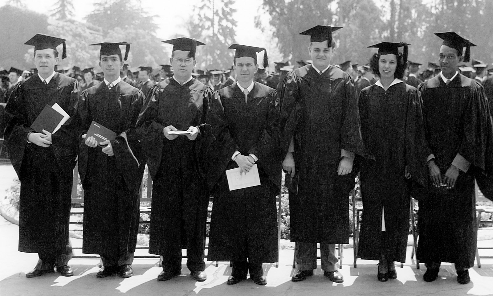 Some of the first graduates of Los Angeles State College in 1948 pose for a photo. This was officially the first Commencement, h