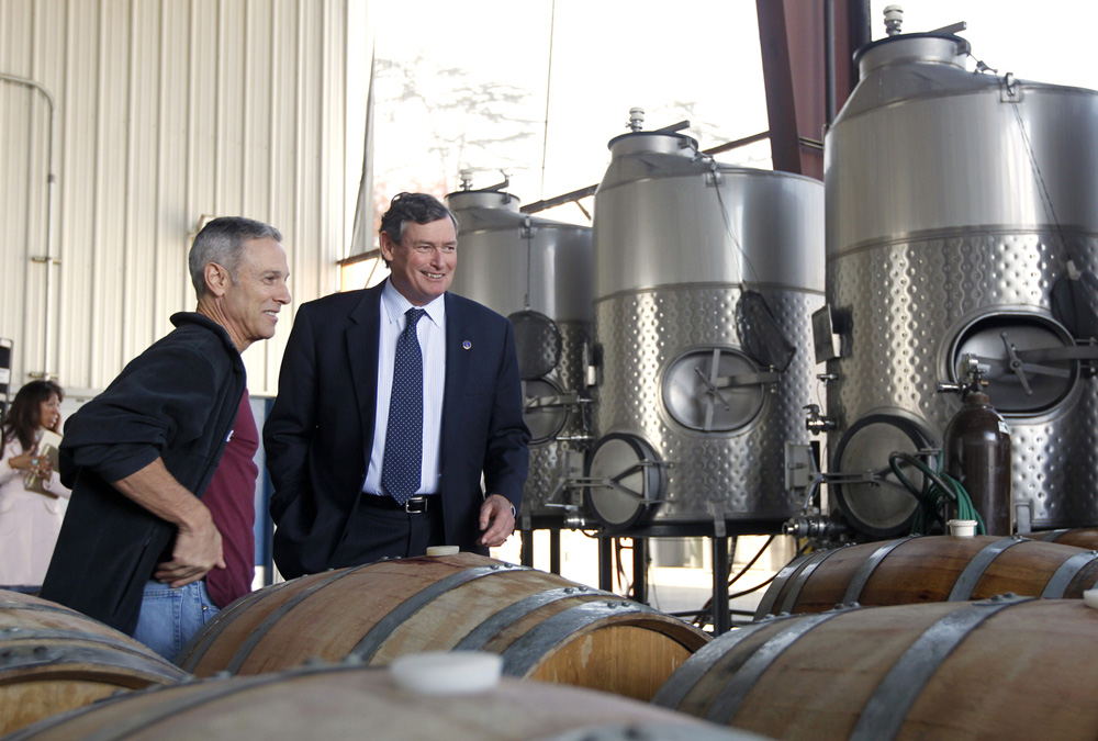 2013 Chancellor Timothy P. White and former campus winemaker/alumnus John Giannini (left) at Fresno State Winery. Fresno State became the first university in the U.S. fully licensed to produce, sell and bottle wine in 1997.