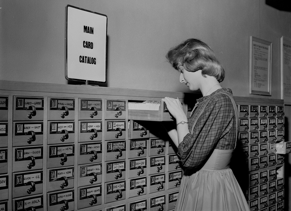 Long Beach   1962A student ​searches the library’s card catalog.