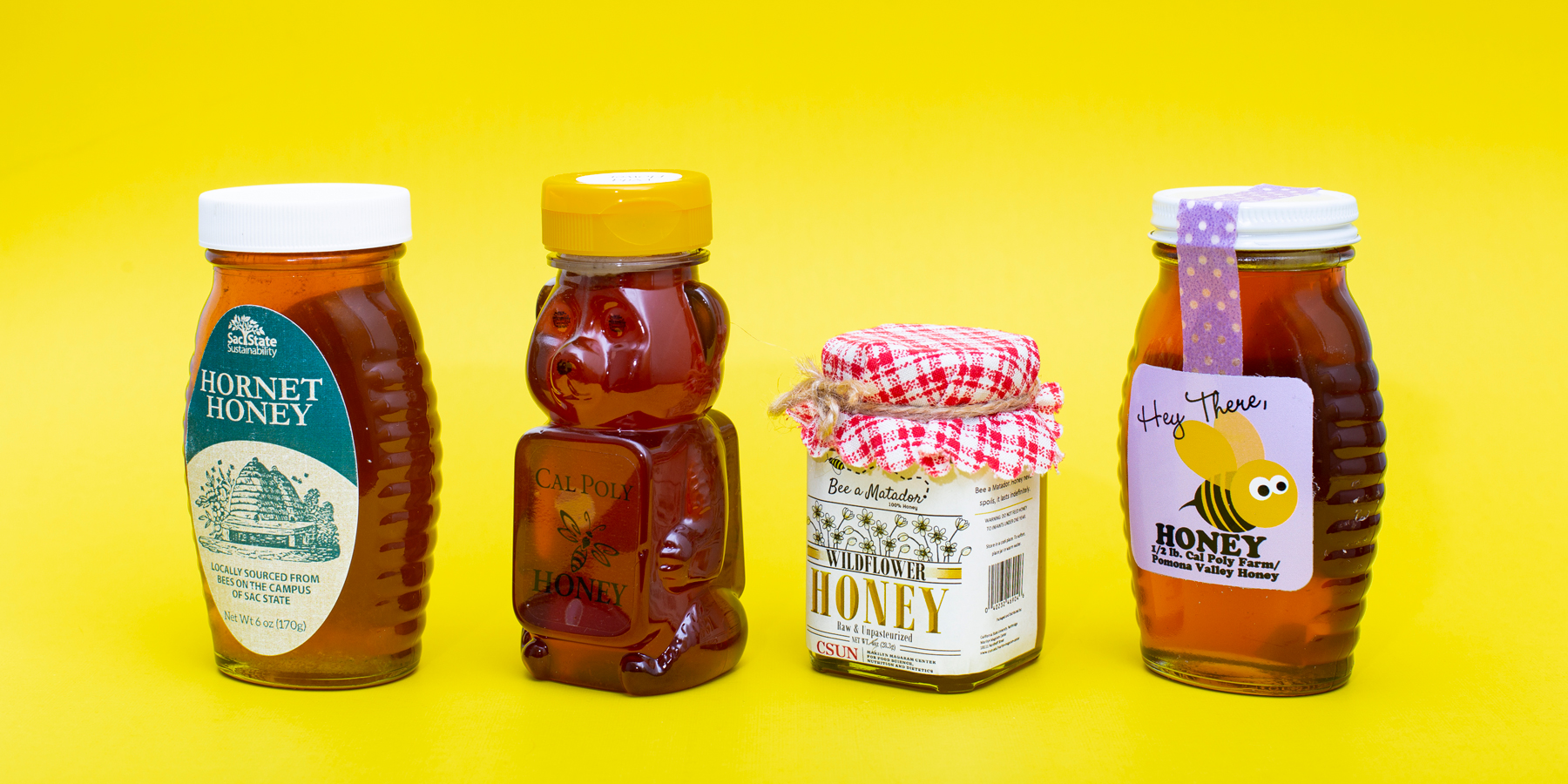 Several CSU campuses make their own honey from on-campus bee hives. From left: Sacramento State's Hornet Honey; Cal Poly San Luis Obispo; CSUN's Bee a Matador Wildflower Honey; and Cal Poly Pomona's Hey There, Honey. (Not pictured: CSU Channel Islands)    