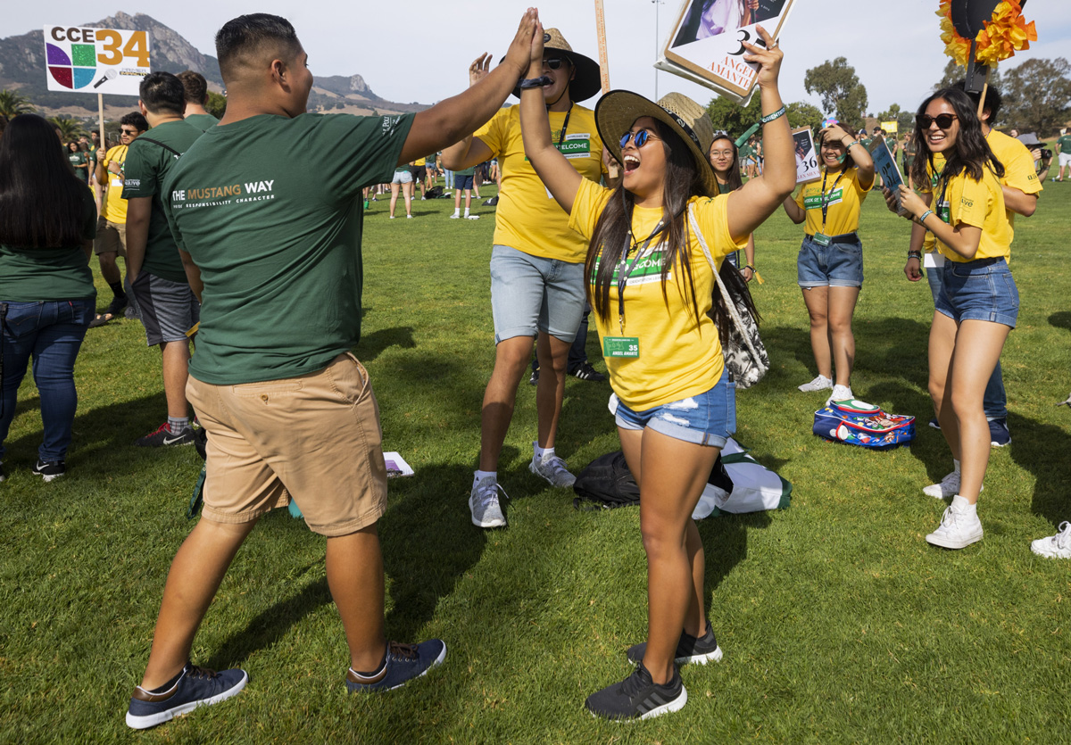 At the start of Cal Poly’s WOW or Week of Welcome student orientation program, WOW leaders, in yellow, welcome their WOWies