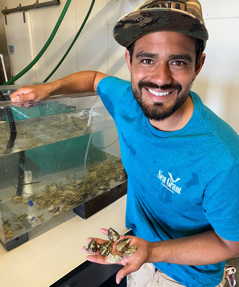 Sea Grant Aquaculture Extension Specialist Kevin Johnson grows oysters that are more resistant to ocean acidification.