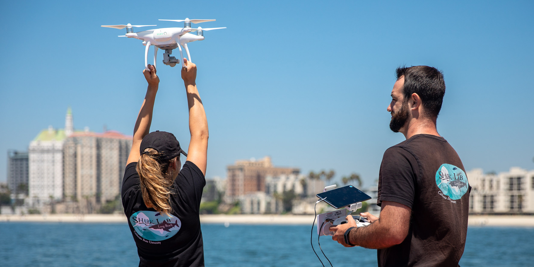 Researchers in the CSULB Shark Lab fly a drone to conduct a coastal survey for sharks.