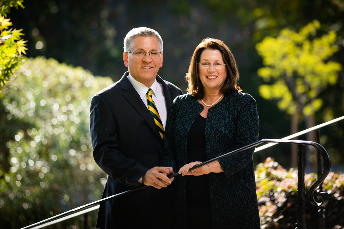 Cal Poly San Luis Obispo President Jeffrey D. Armstrong and his wife, Sharon, pose for a photo near their residence during an evening in spring, May 17, 2019.