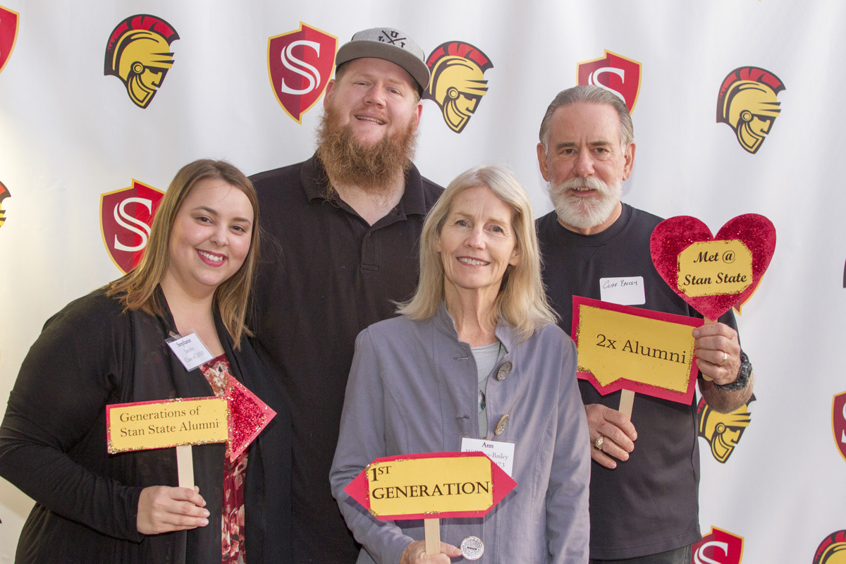 Cliff and Ann Bailey (far right), class of 1973, started their love affair at Stanislaus State. Their son, Clifford (third from right), also graduated from the campus in 2010. Pictured at far left is Stanislaus State lecturer Stephanie Jacobs. 
