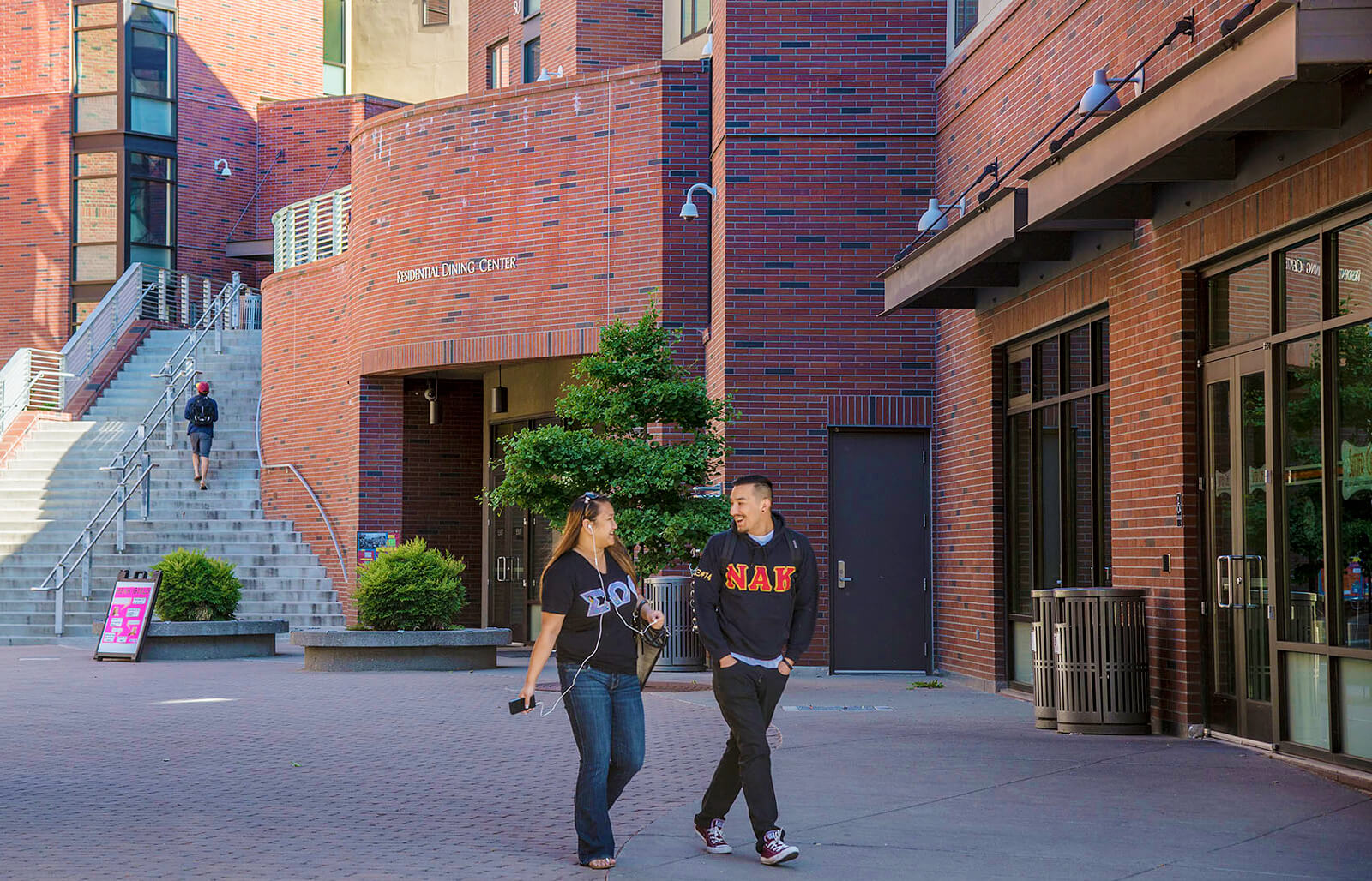 Students walking in front of campus building.