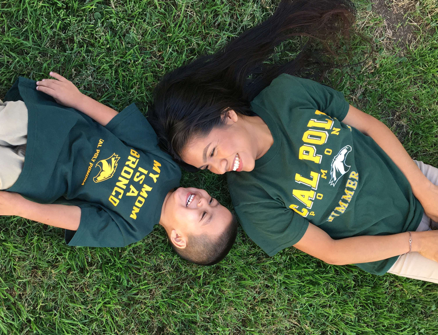 Yuliana Rosas and her son lying in the grass.