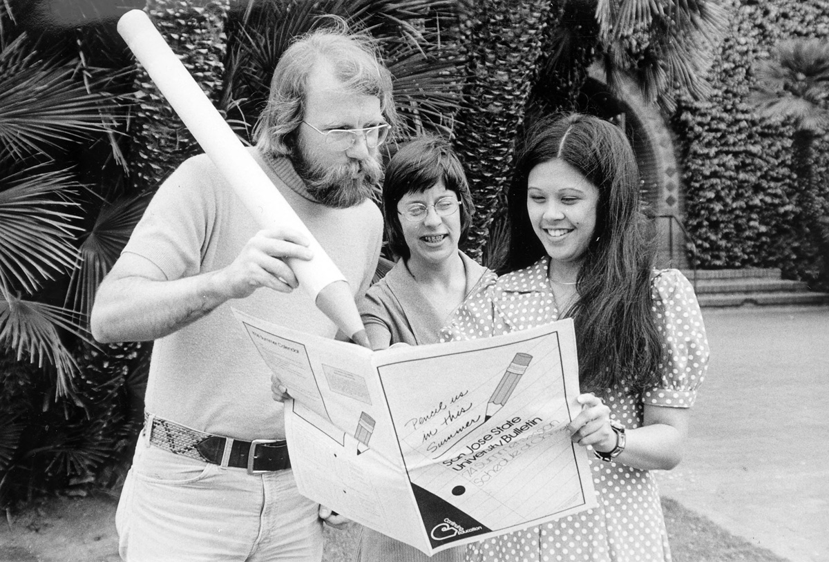 Members of the San José State campus community show off a 1974 summer bulletin.